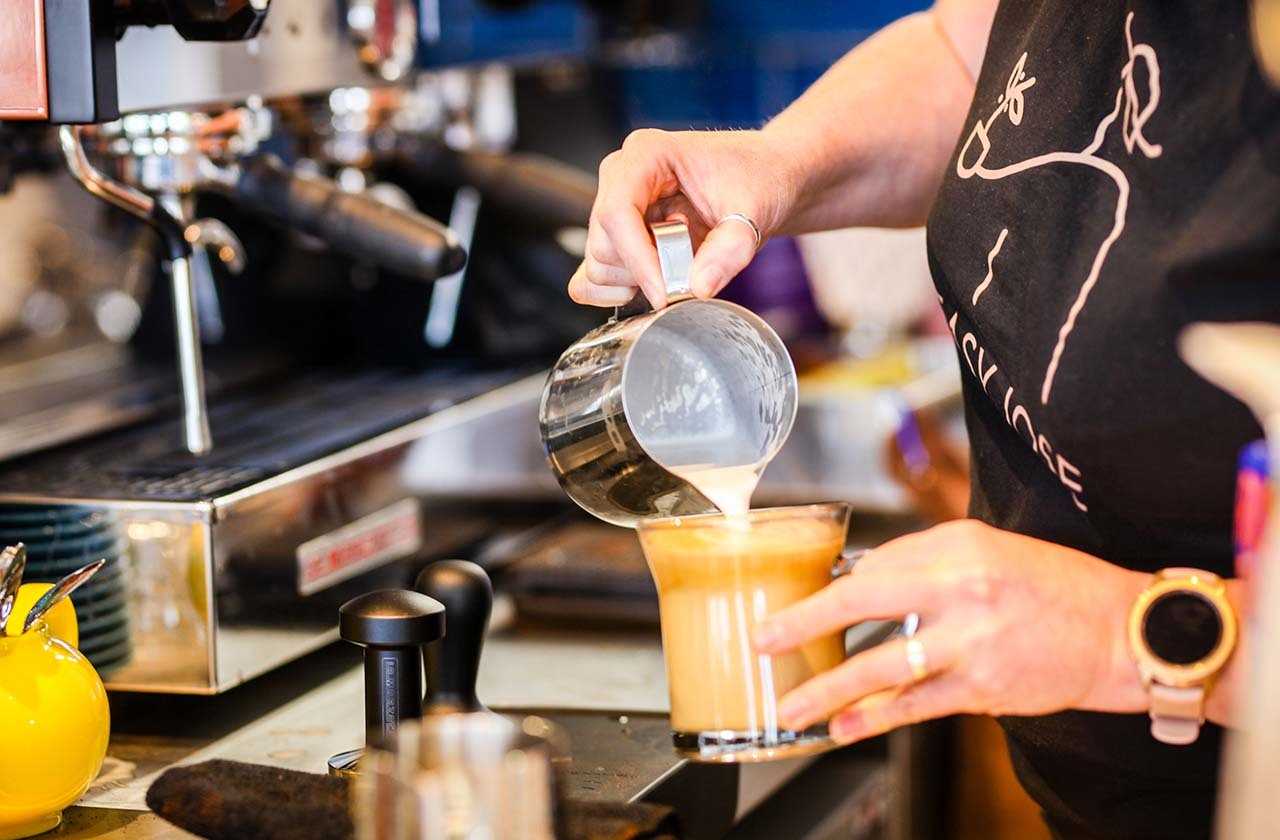 Barista preparing a latte coffee